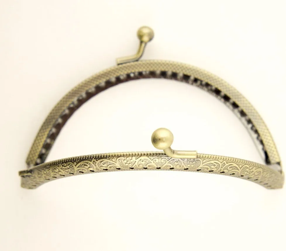 HAND PF12 Antique Bronze Tone Round Purse Frame - 105 x 55 mm - with Decorative Flower Engravings and Perforations, and Kiss Clasp Lock Handle