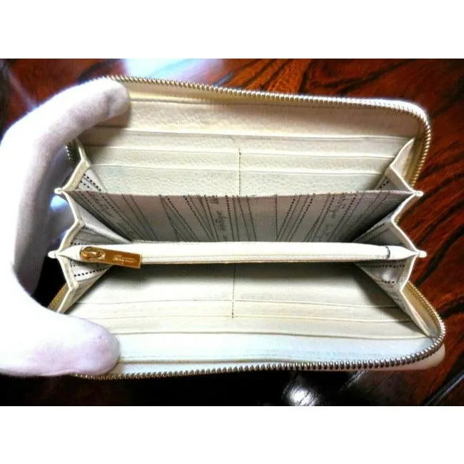 Salvatore Ferragamo White Leather With Brown Contrast Stitching And A Quilted Double Gancini Zip Around Wallet